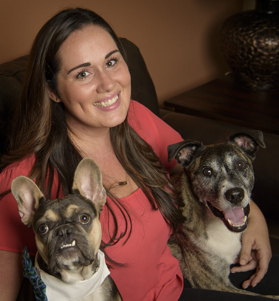 woman with two medium sized dogs